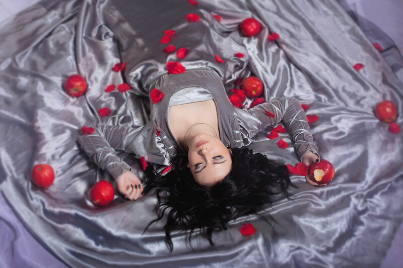 Woman Lying on Silver Fabric