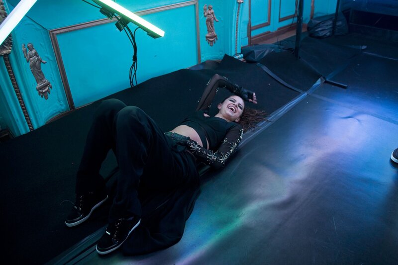 woman lying on stage laughing