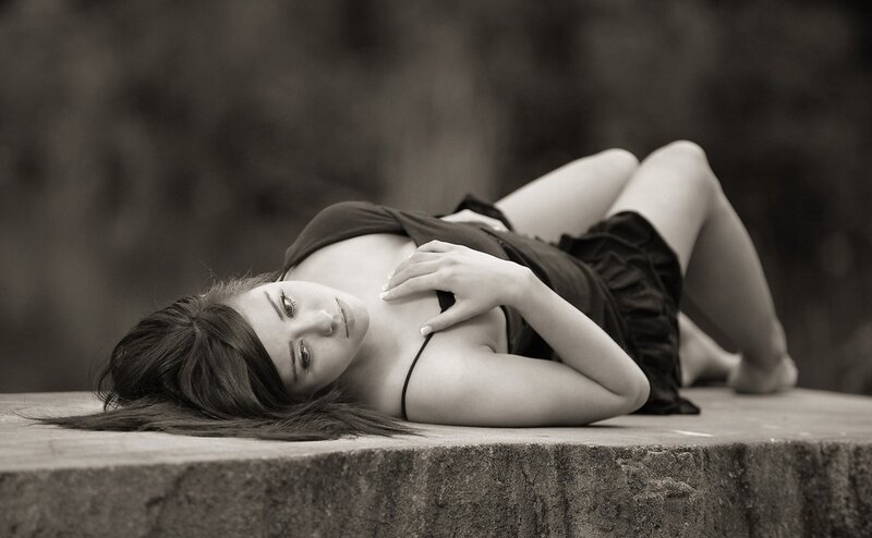 woman lying on stone