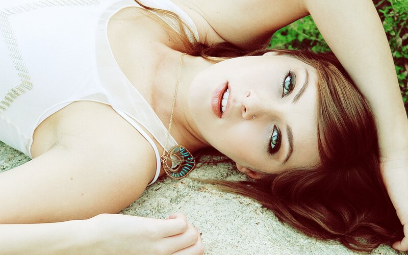 woman lying on stone