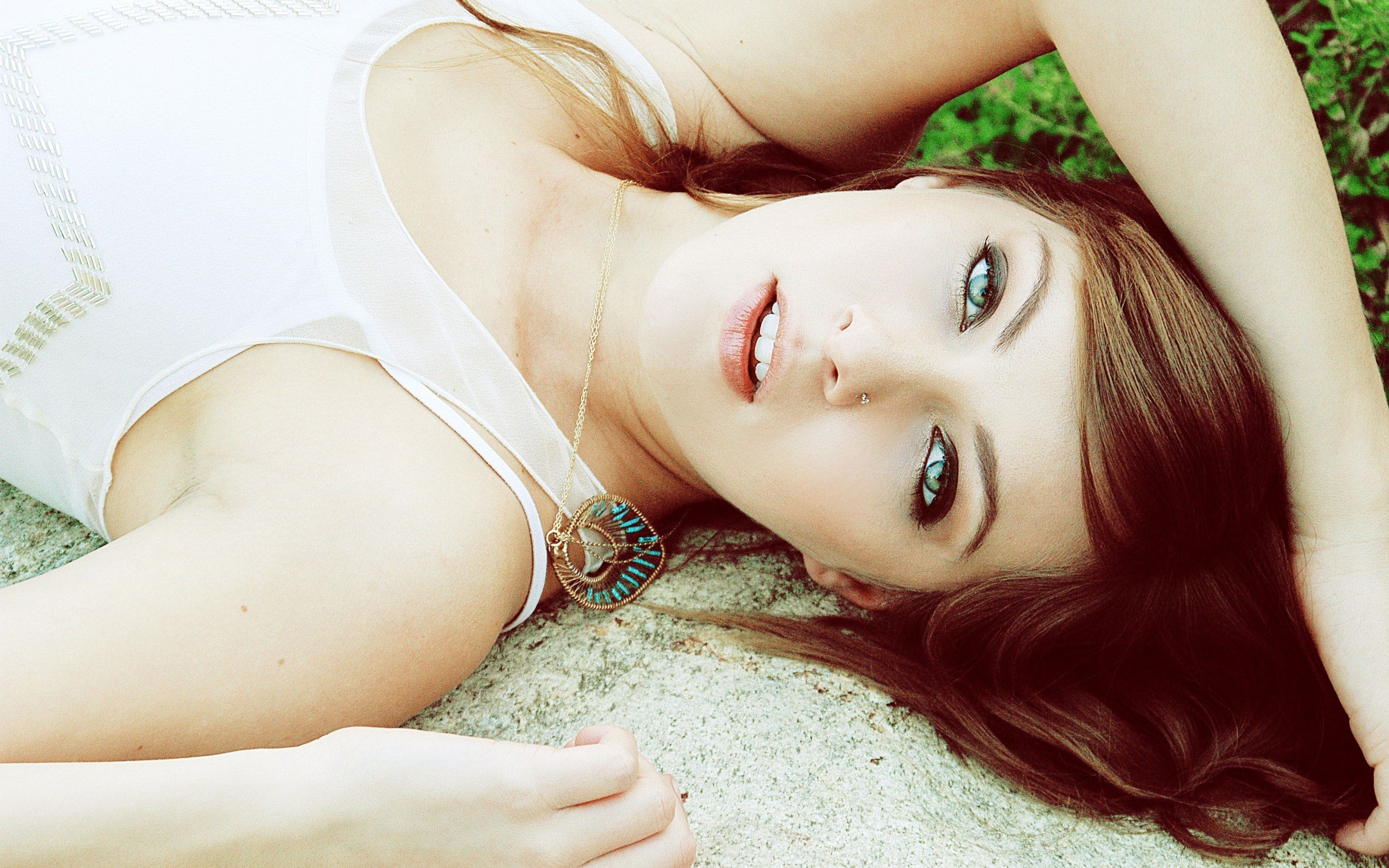 woman lying on stone