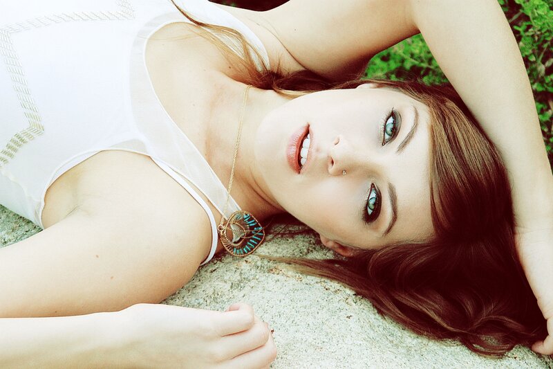 woman lying on stone