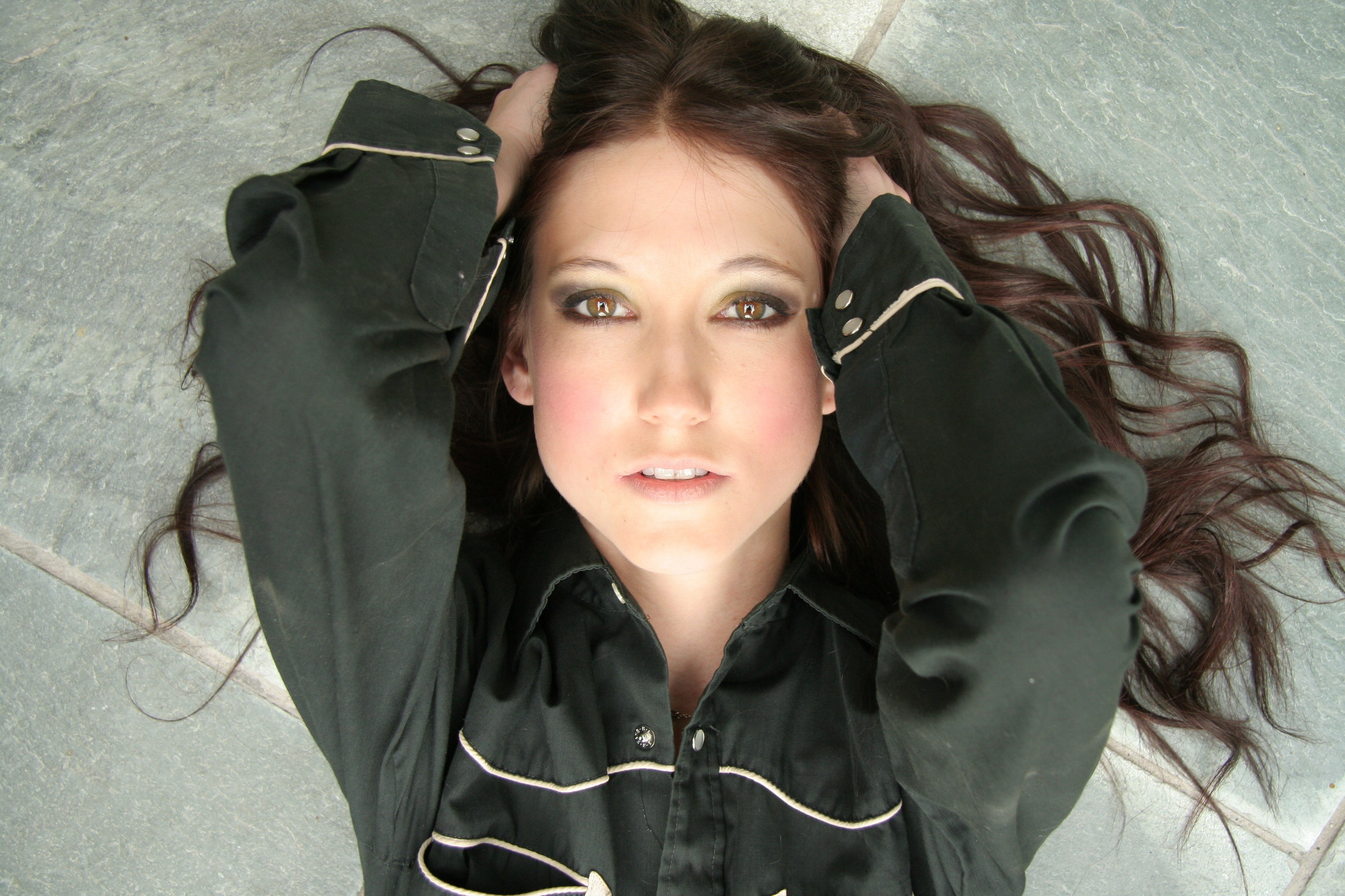 woman lying on stone floor