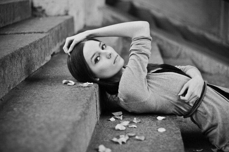woman lying on stone steps