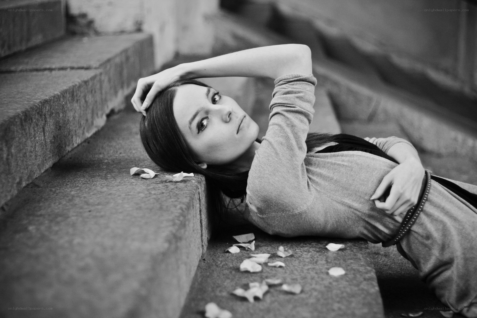 woman lying on stone steps