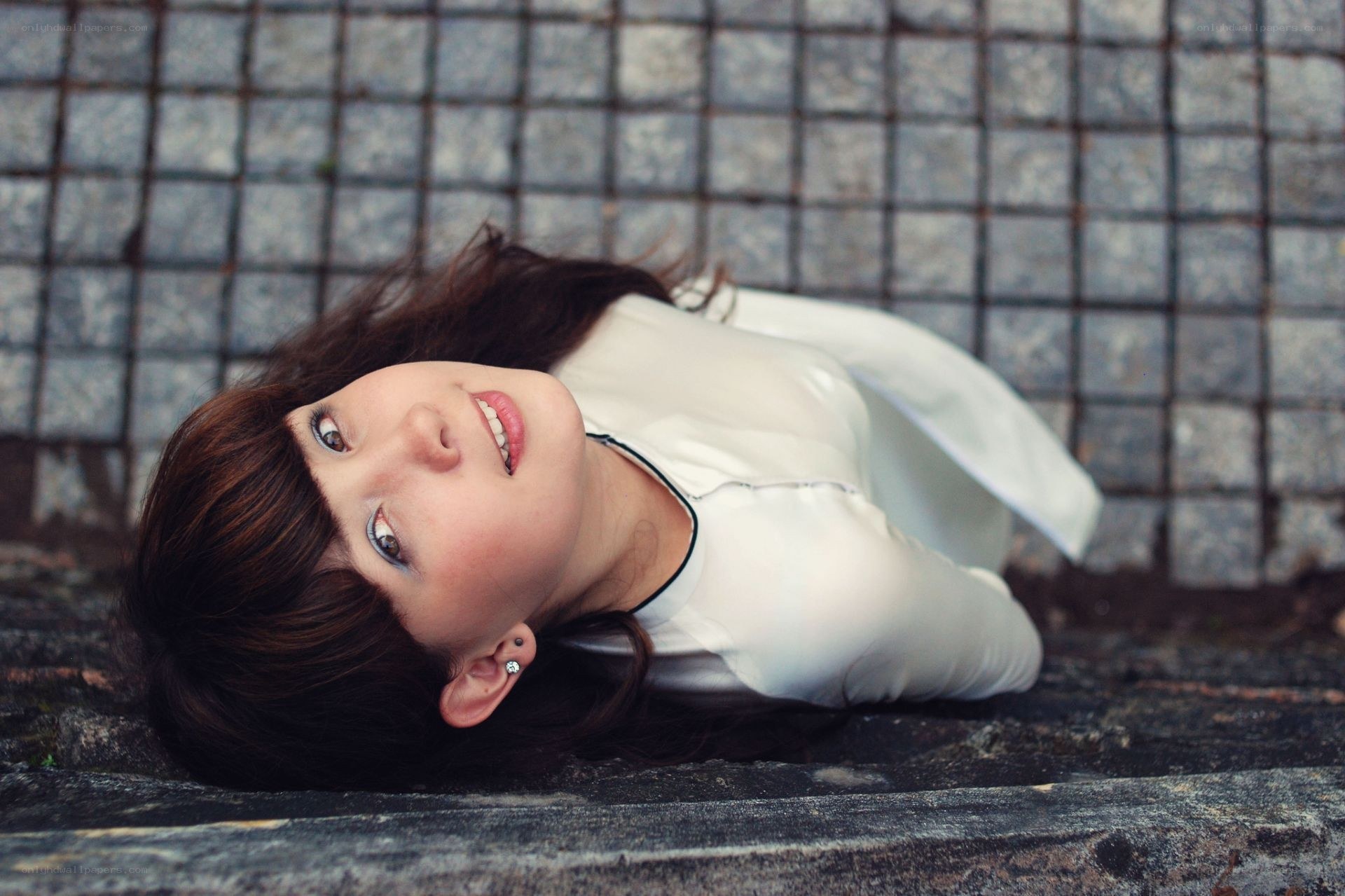 woman lying on stone steps