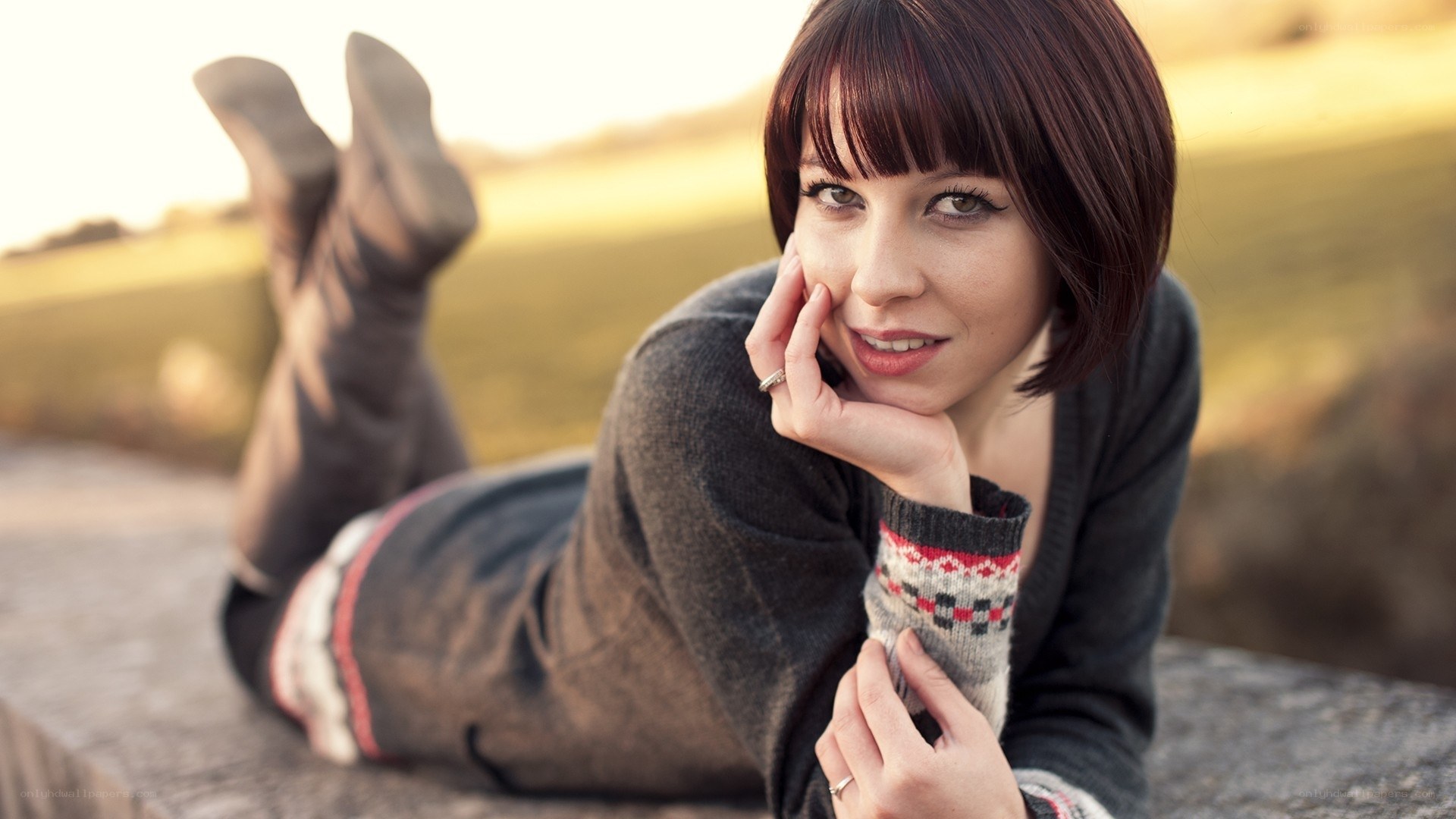 woman lying on stone