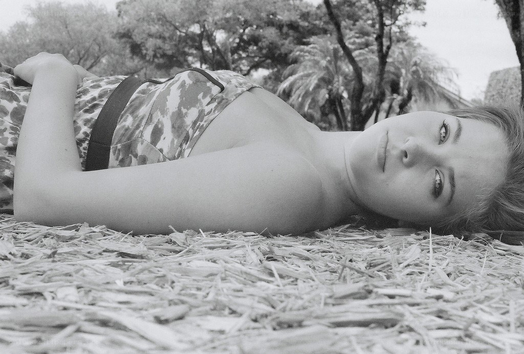 woman lying on straw