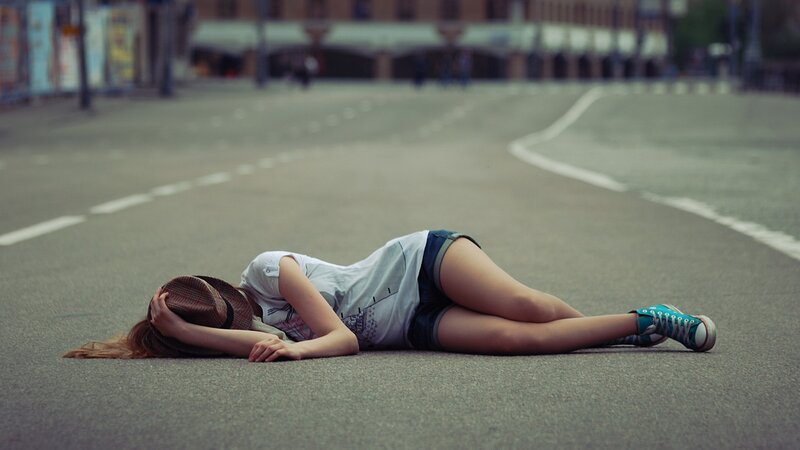 Woman lying on street