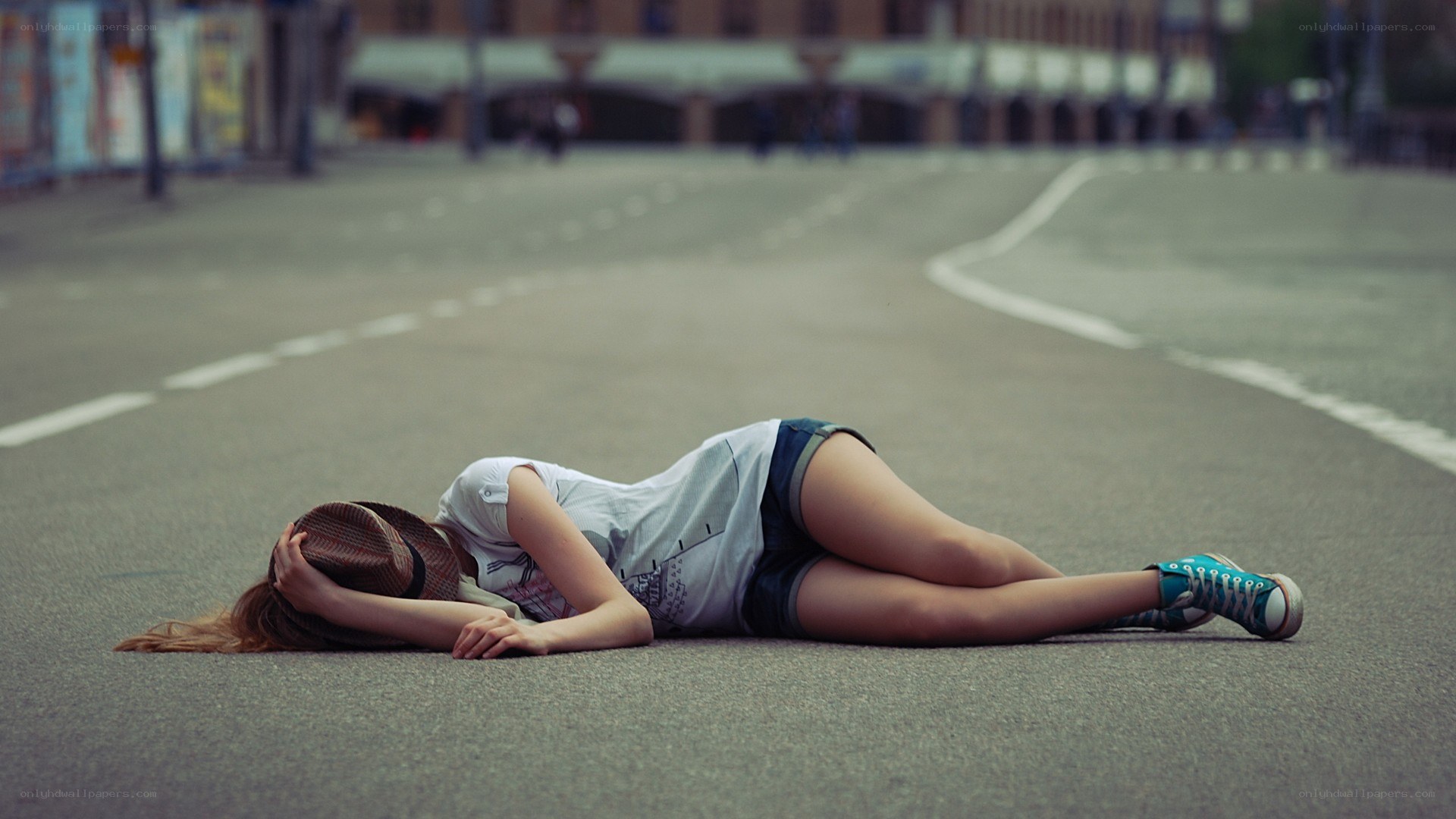 Woman lying on street