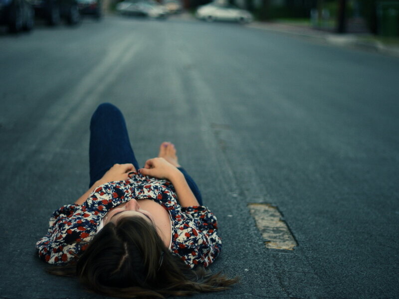 Woman Lying on Street — Gray