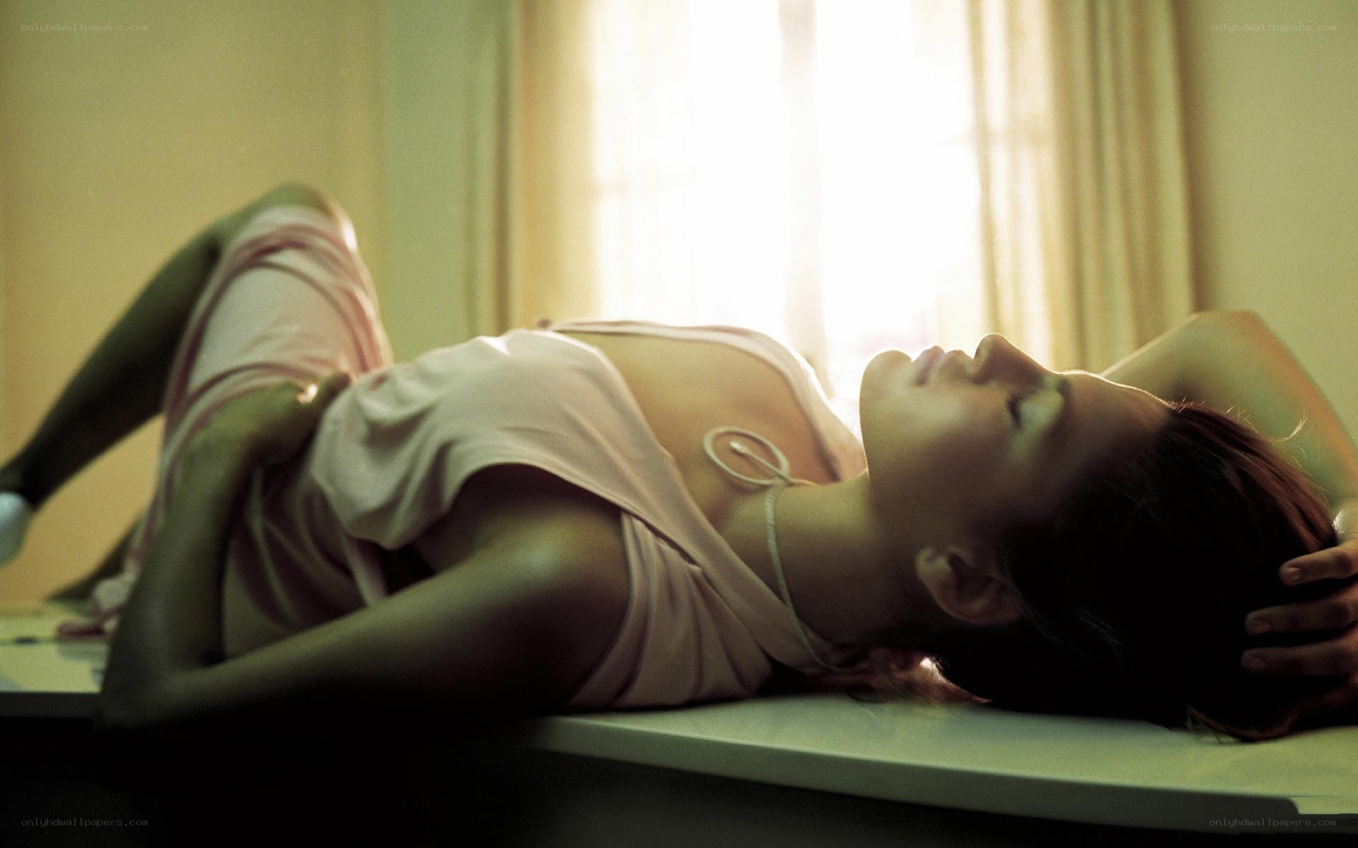 woman lying on table in sunlight