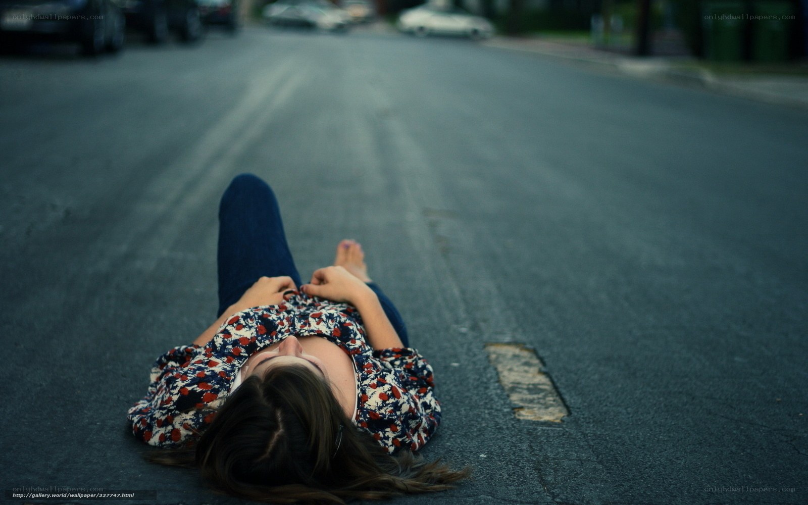 Woman lying on the street