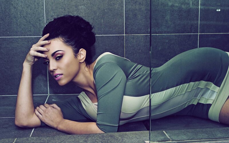 Woman Lying on Tiled Floor — Green, Dramatic