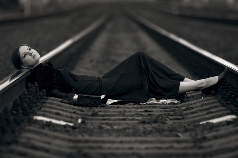 Woman Lying on Train Tracks — Black, Dramatic, Photograph, Train Tracks, Dress