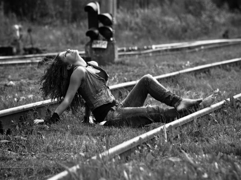 Woman Lying on Train Tracks — Black, Dramatic