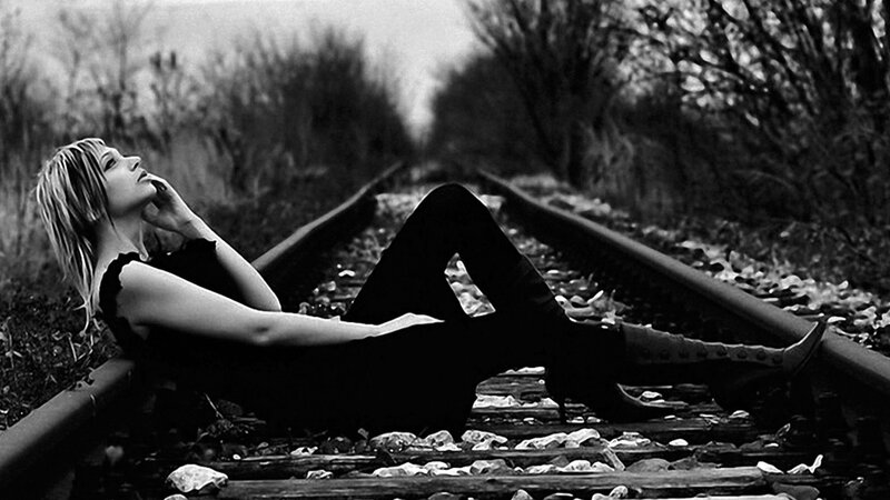 Woman Lying on Train Tracks — Black, Melancholic