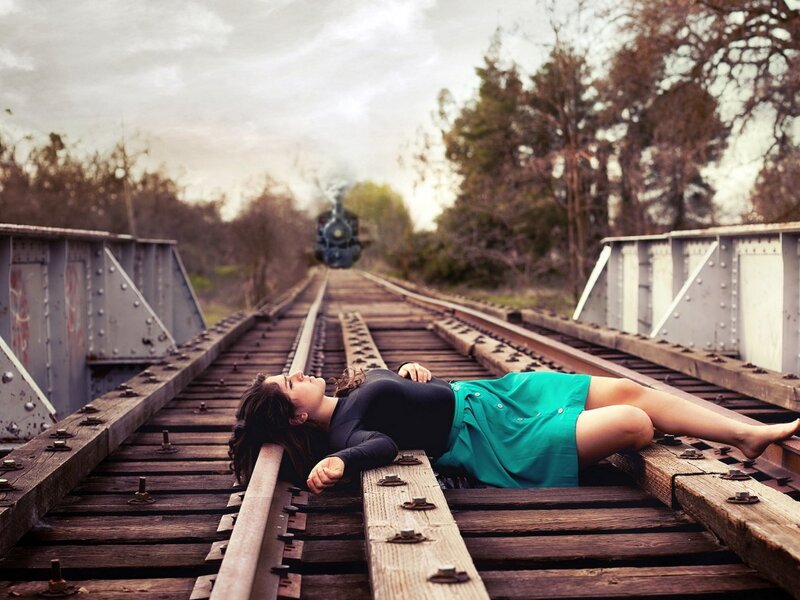 Woman Lying on Train Tracks — Green