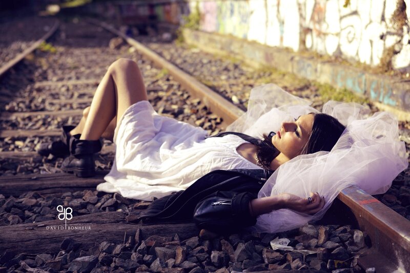 Woman Lying on Train Tracks — White