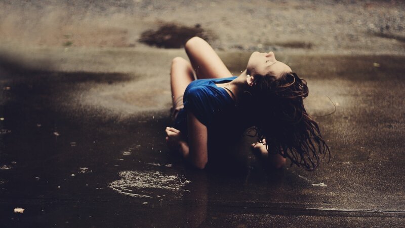Woman Lying on Wet Ground — Blue