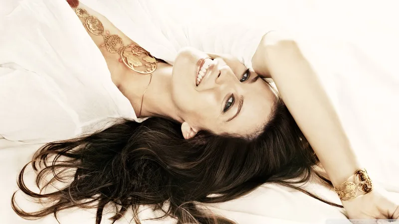 woman lying on white bed