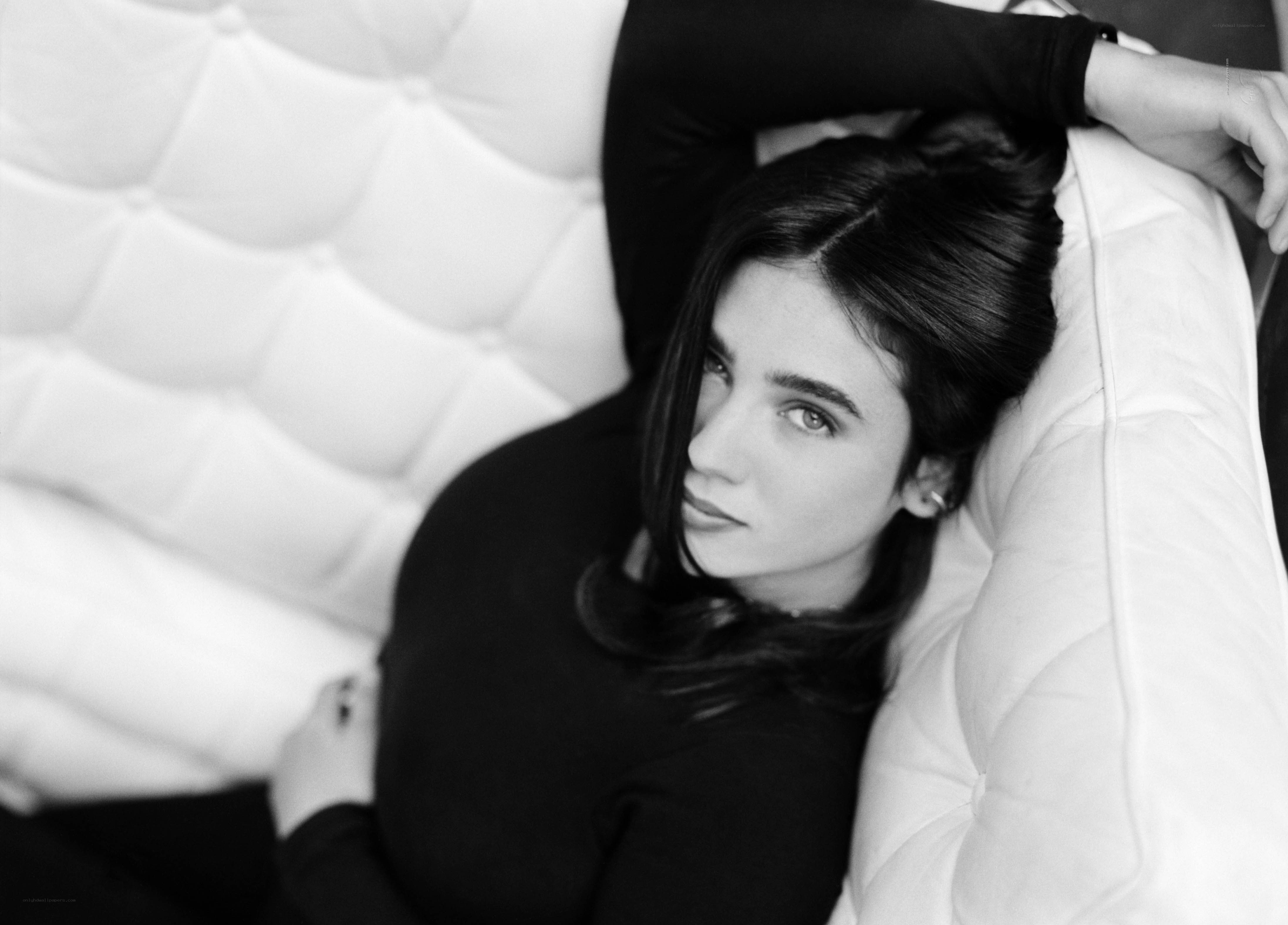 woman lying on white couch