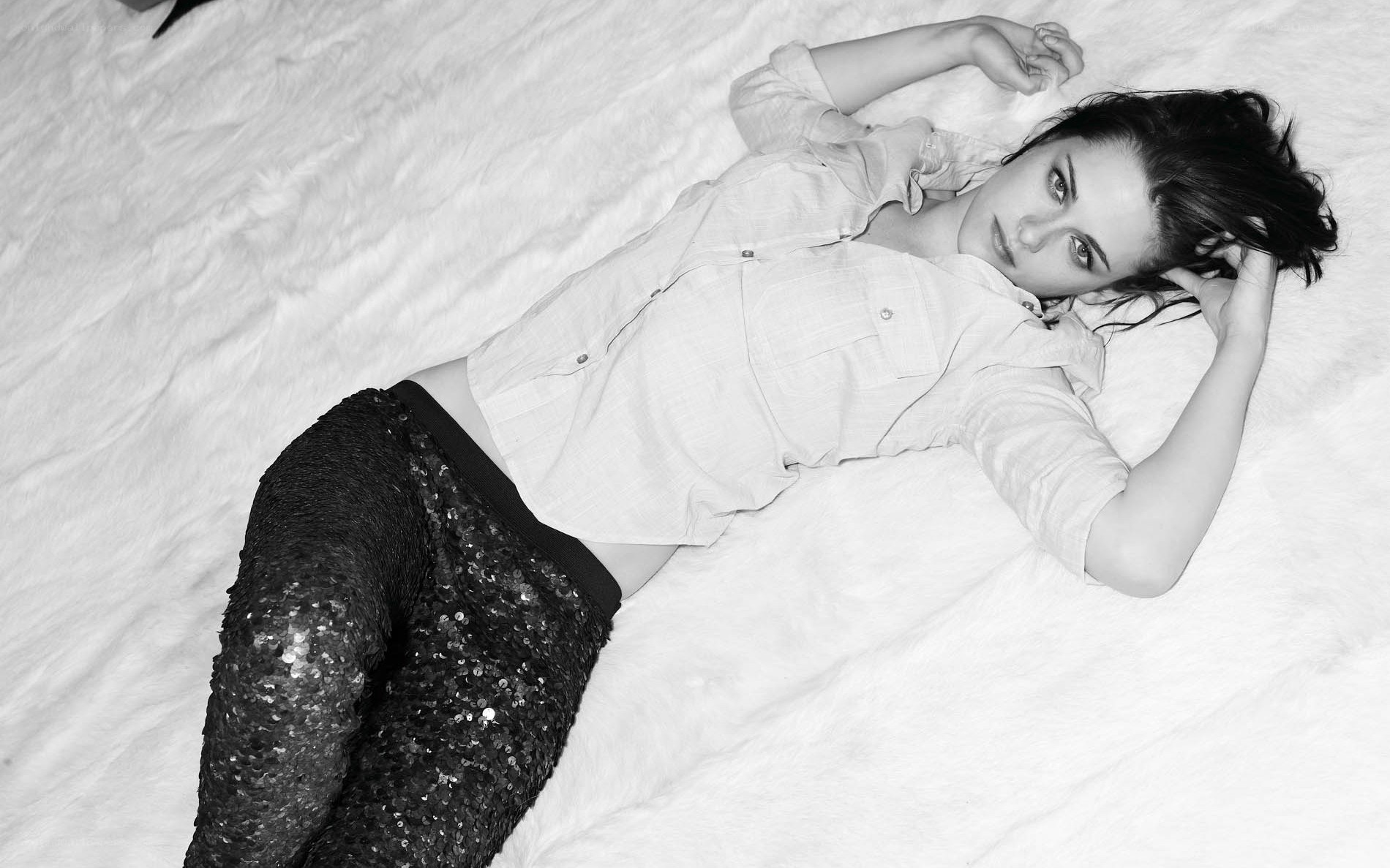 woman lying on white surface