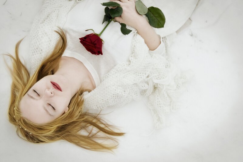 Woman Lying on White Surface — Serene, Photograph