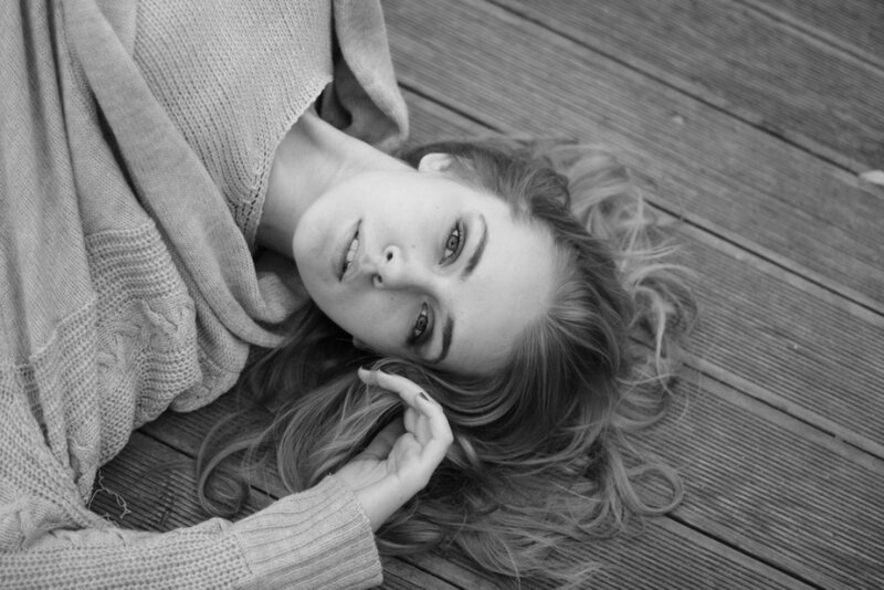 Woman Lying on Wooden Deck — Black