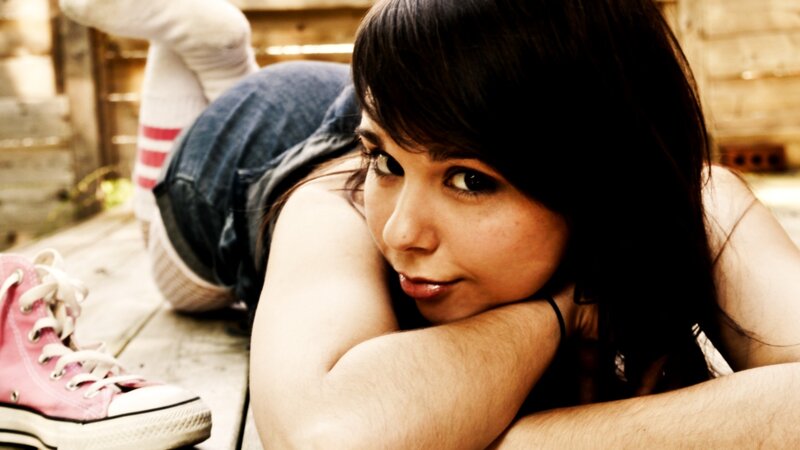 woman lying on wooden floor