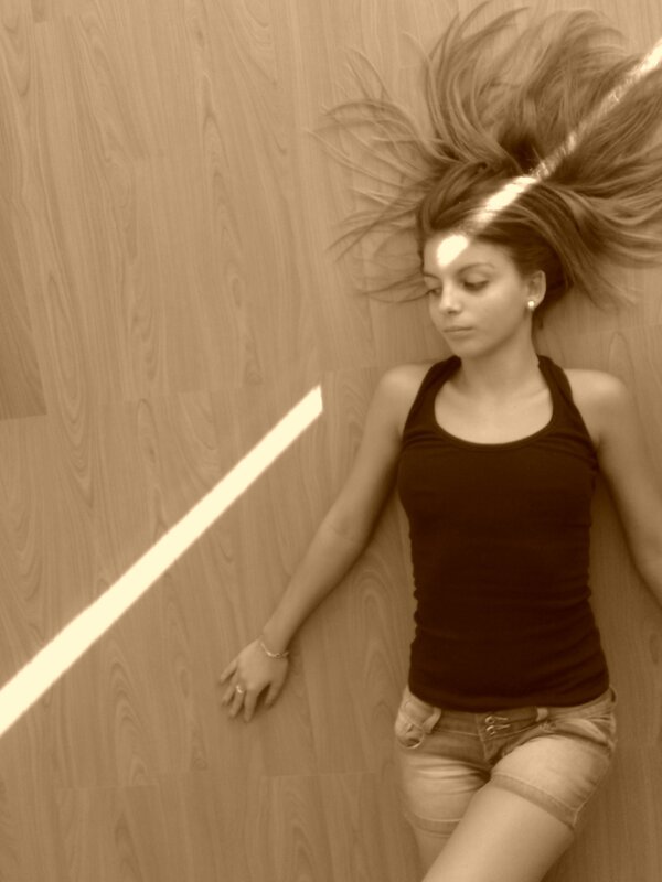 woman lying on wooden floor