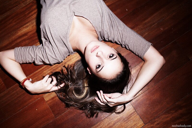 woman lying on wooden floor