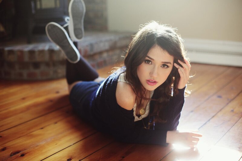 woman lying on wooden floor