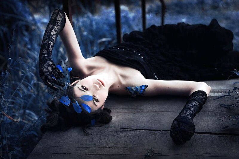 Woman Lying on Wooden Surface — Blue