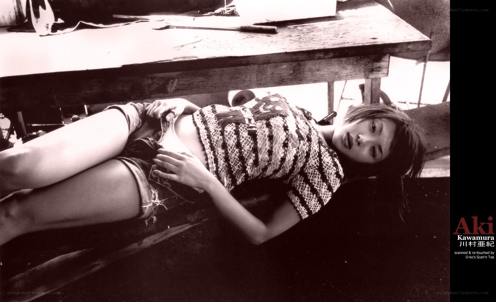woman lying under a table
