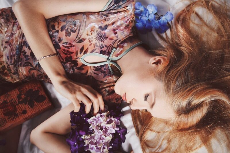 Woman Lying with Flowers — Purple, Serene, Photograph