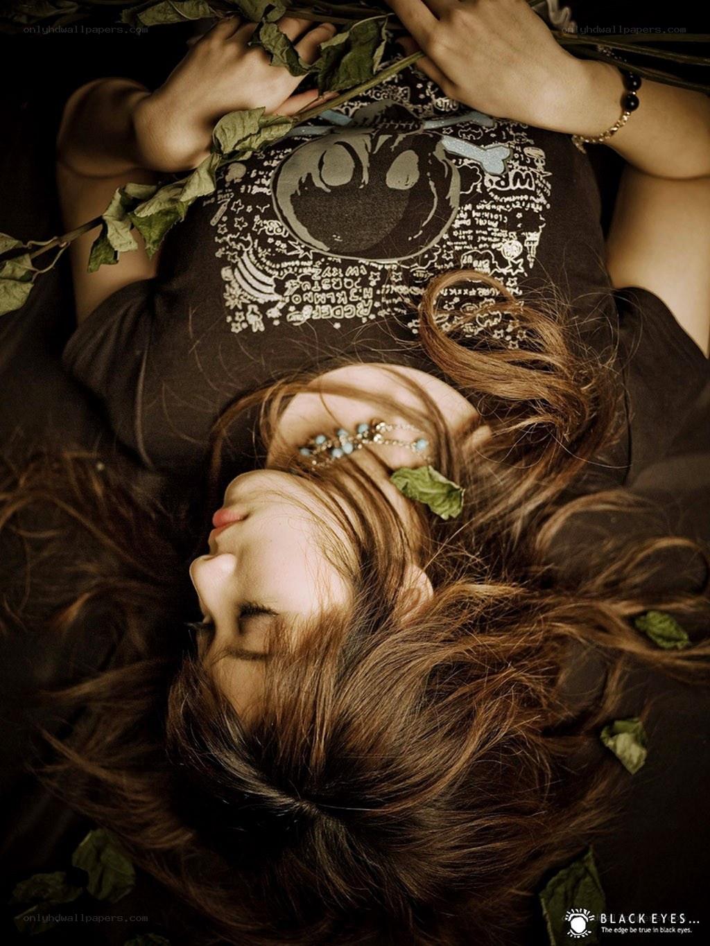 woman lying with leaves