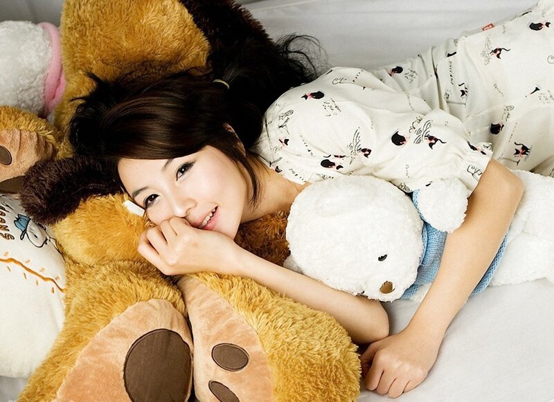 Woman Lying with Stuffed Animals
