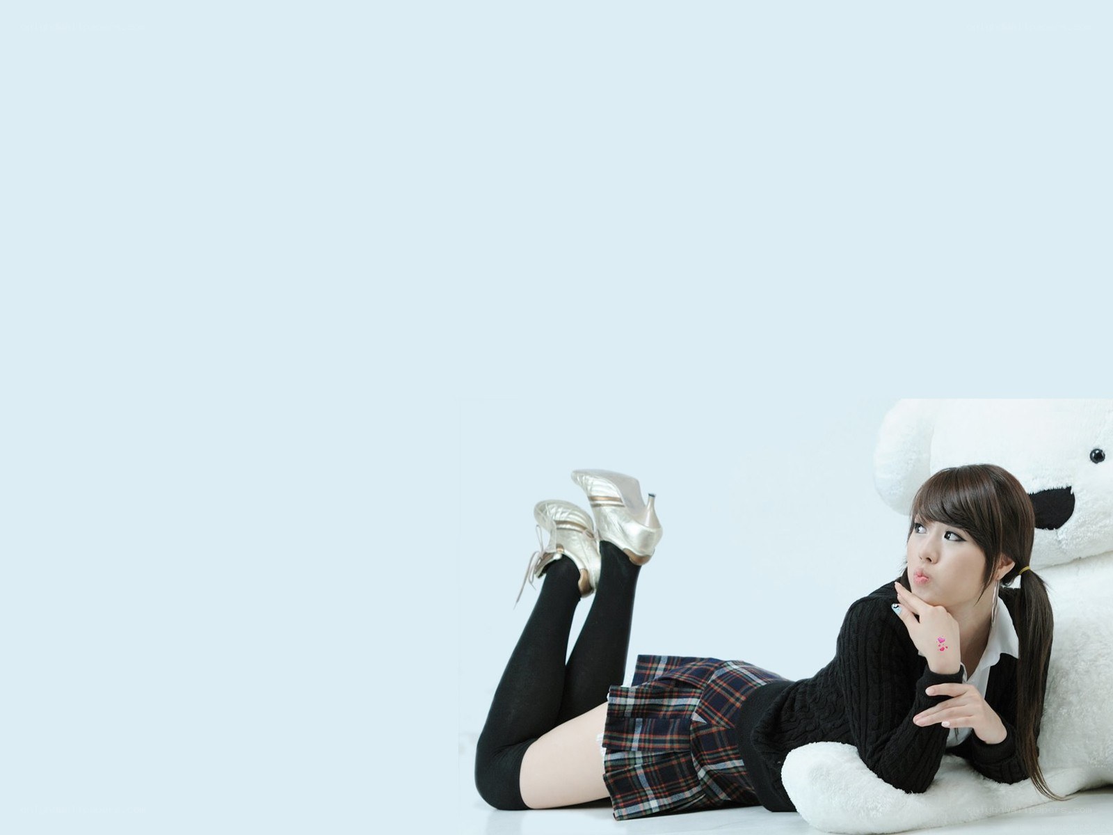 woman lying with teddy bear