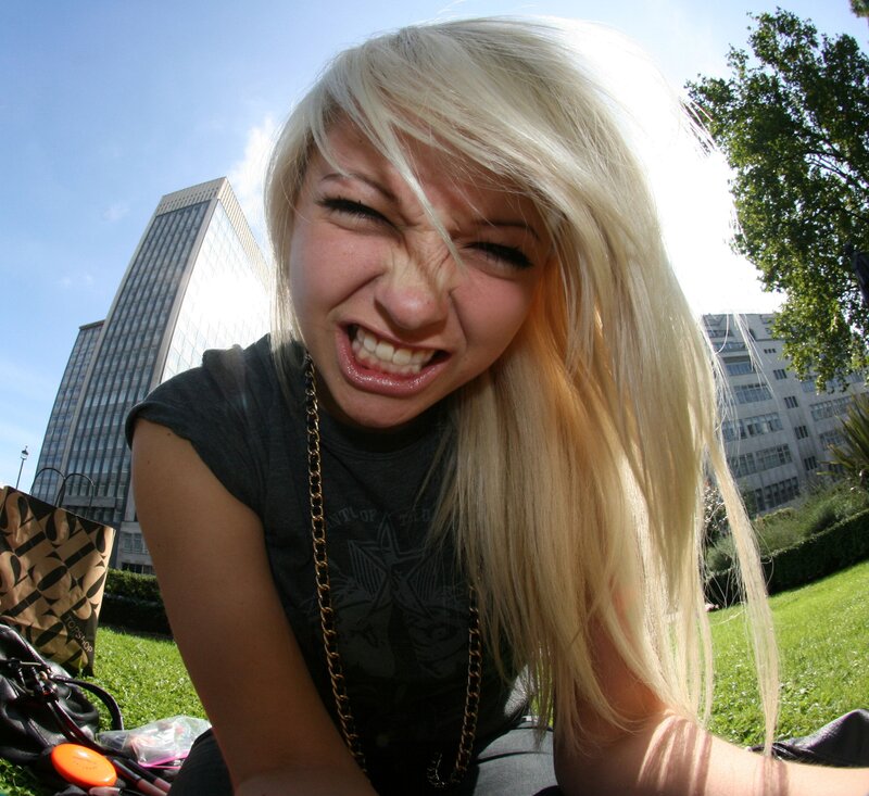woman making a face in park