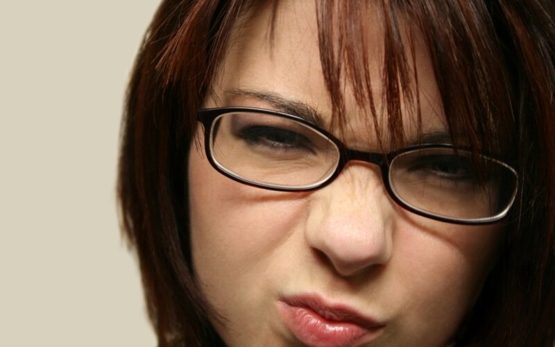 woman making a face with glasses
