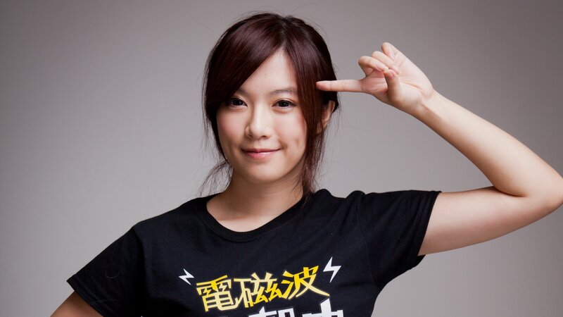 woman making a gun gesture