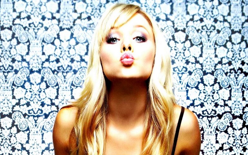 woman making a kiss face