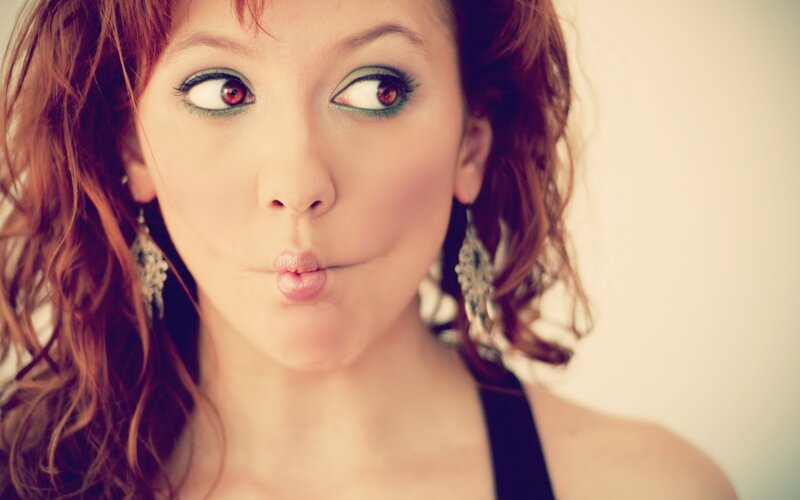 woman making a kiss face