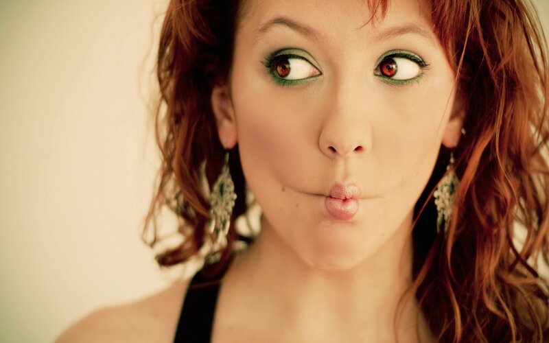 woman making a kiss face