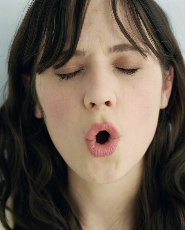 woman making a kissing face
