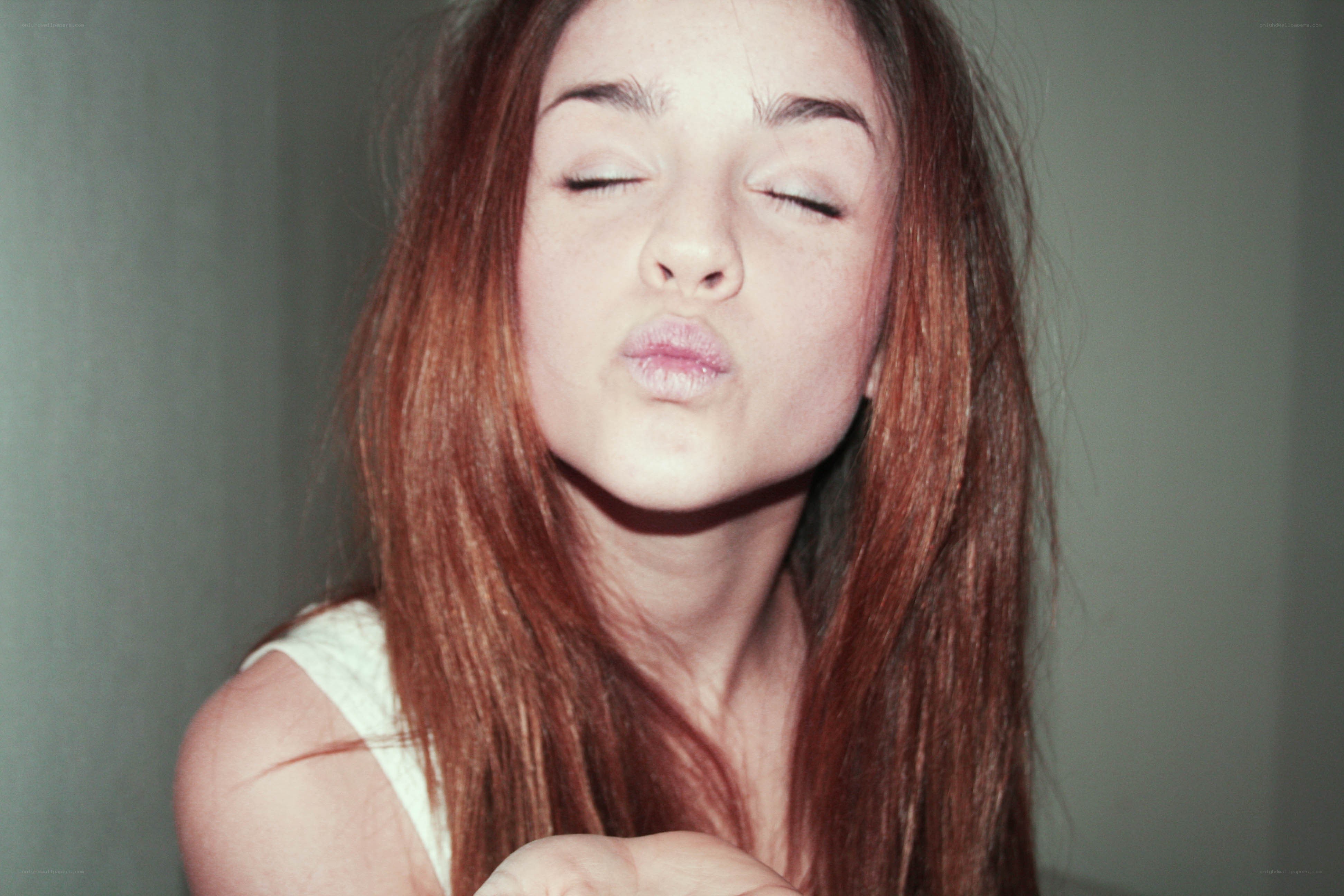 woman making a kissy face