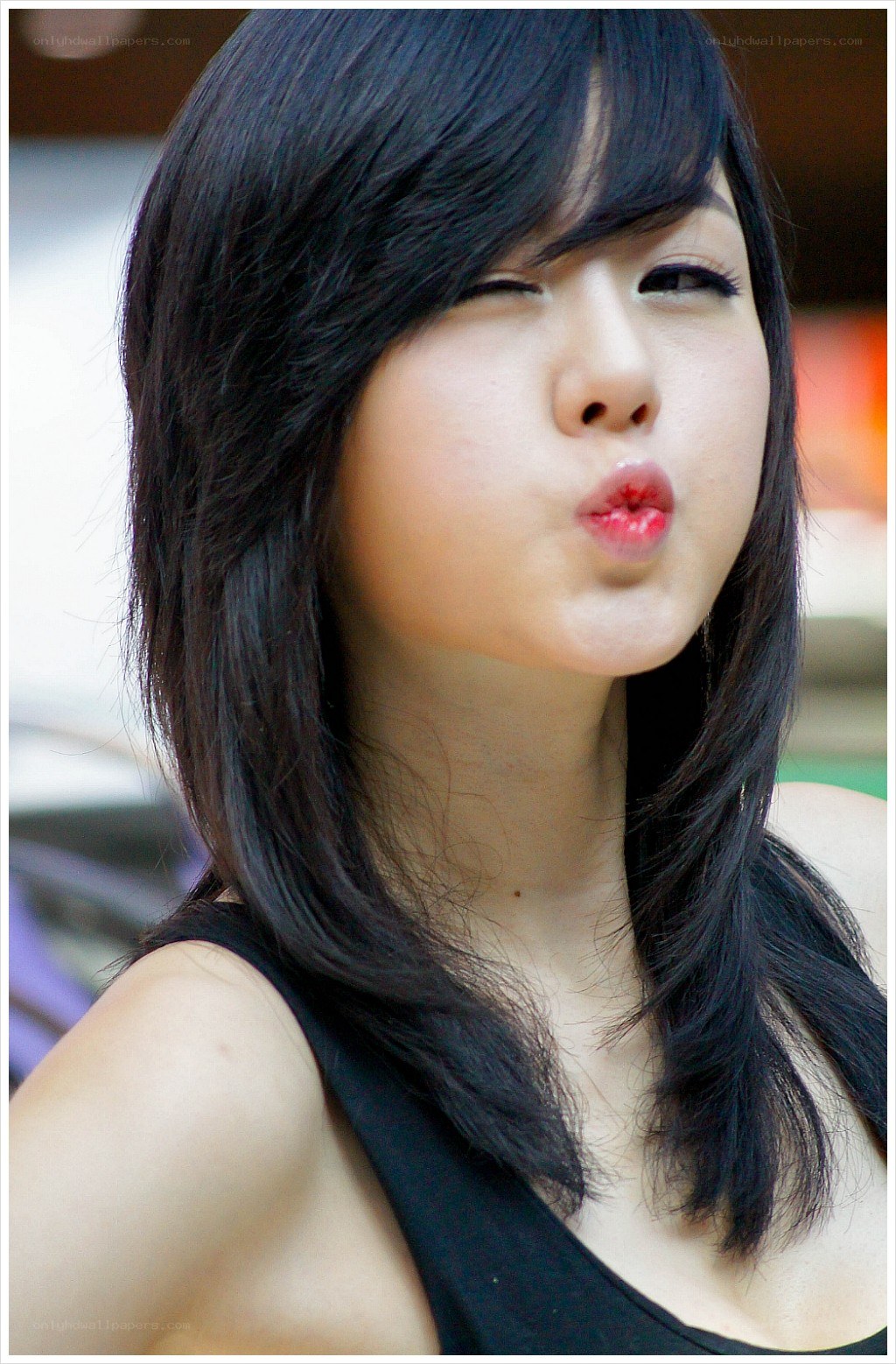 woman making a kissy face