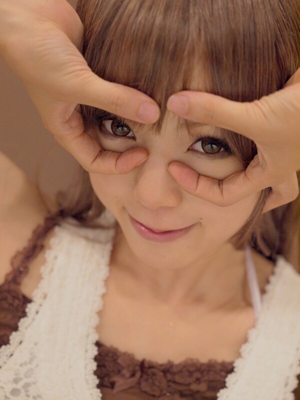 woman making eyes with hands