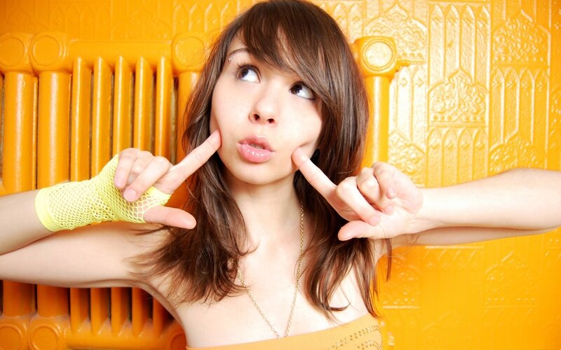 Woman Making Face — Yellow, Playful